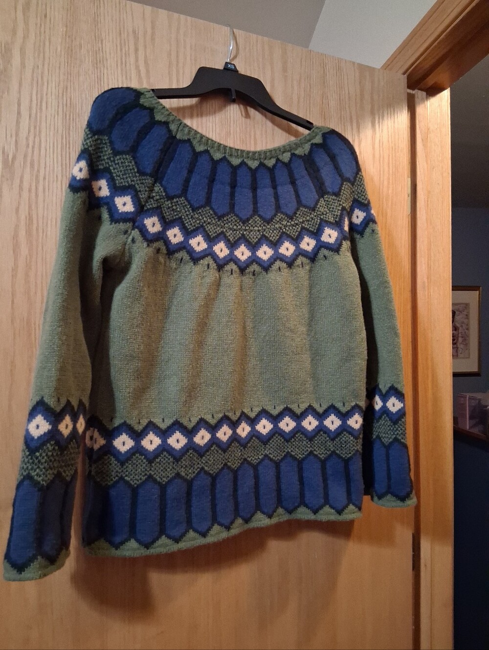 hand-knitted Long Sleeve fair isle style yoke sweater with geometric patterns.